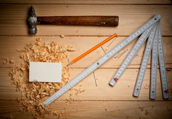 Set of tools over a wood panel with space for text — Stock Photo, Image