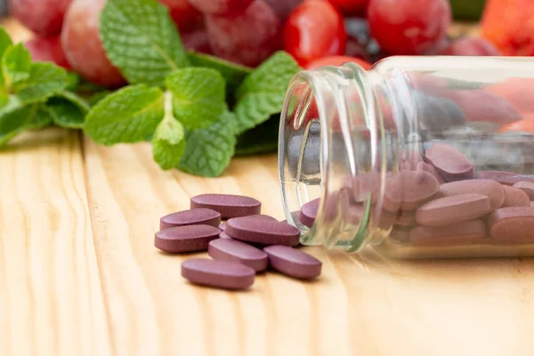 Purple Vitamins Supplements Wooden Table Variety Fruit — Stockfoto