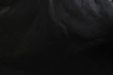 black wrinkled paper texture and background. top view