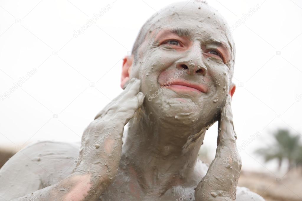 Man receives mud treatment