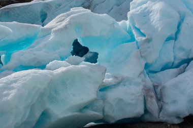 Shiny blue ice of Nigardsbreen glacier clipart