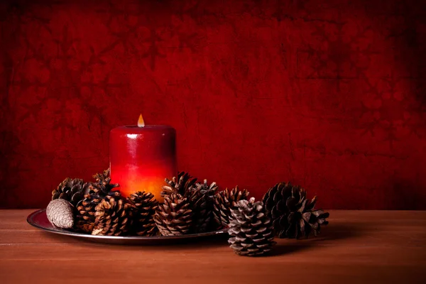 Candle And Pine Cones — Stock Photo, Image