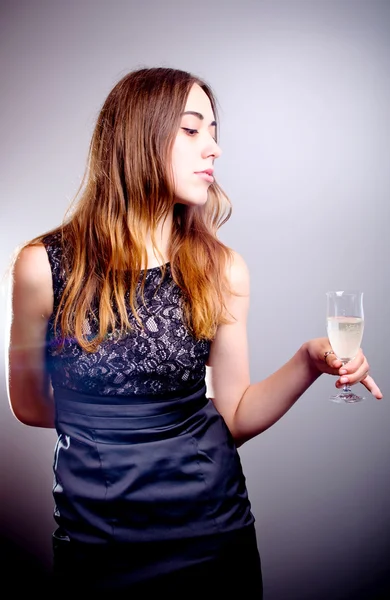 Young beautiful woman drinks wine — Stock Photo, Image