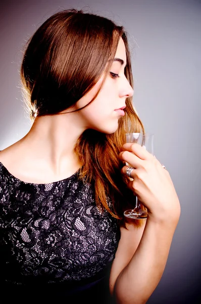 Woman drinks wine from wine glass — Stock Photo, Image