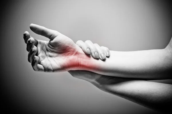 Acute pain in a women wrist — Stock Photo, Image