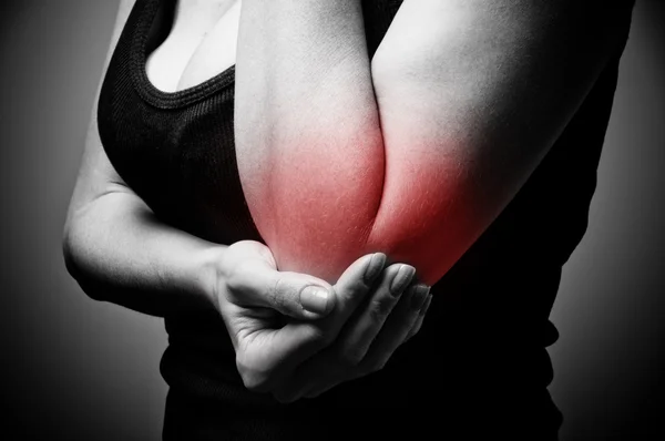 Woman having pain in her elbow — Stock Photo, Image