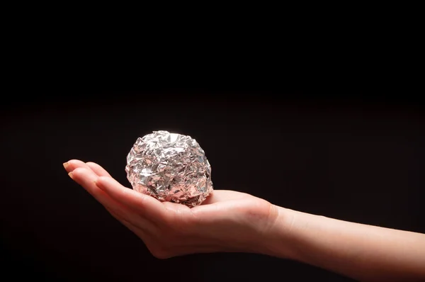 Woman holding an aluminum foil — Stock Photo, Image