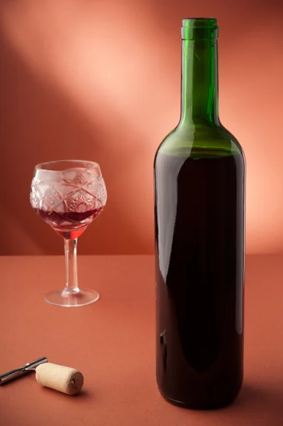 Bottle with red wine and glass — Stock Photo, Image