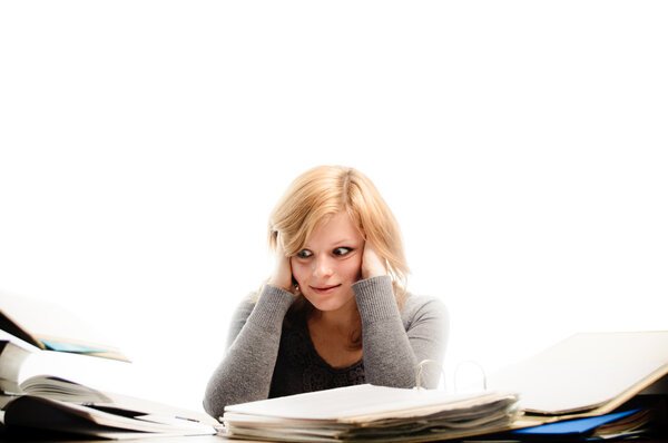 Stressed student revising for an exam - isolated on white backgr