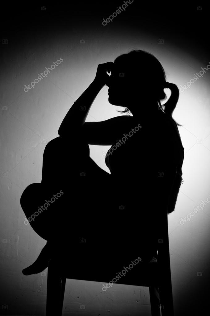 Sad woman sitting alone in a empty room - black and white Stock Photo by  © 19883763