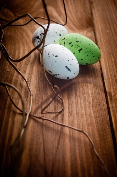 Easter eggs on wooden plank — Stock Photo, Image