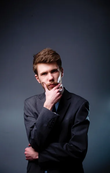 Thoughtful young businessman — Stock Photo, Image
