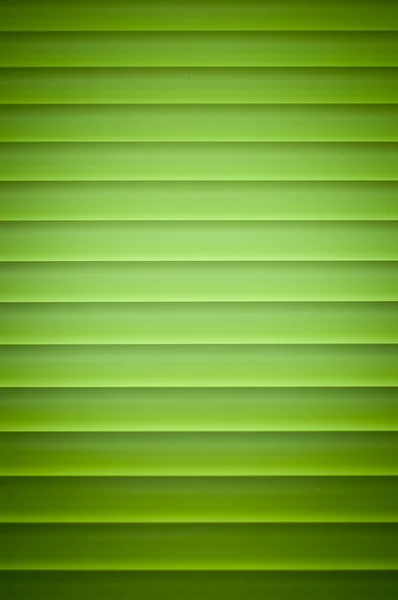 Green metallic blinds on a window — Stock Photo, Image