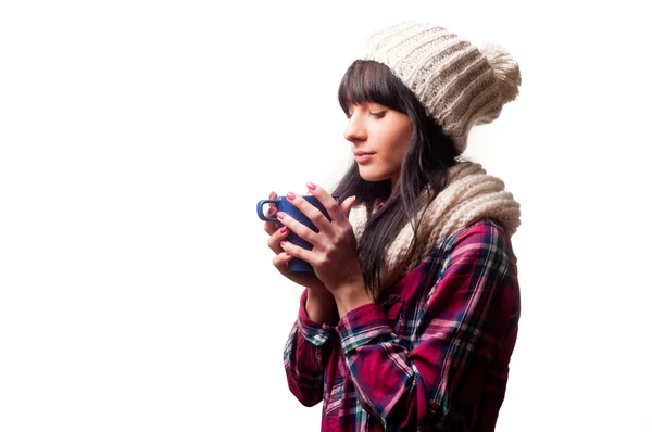 A cold woman drinking a hot drink — Stock Photo, Image