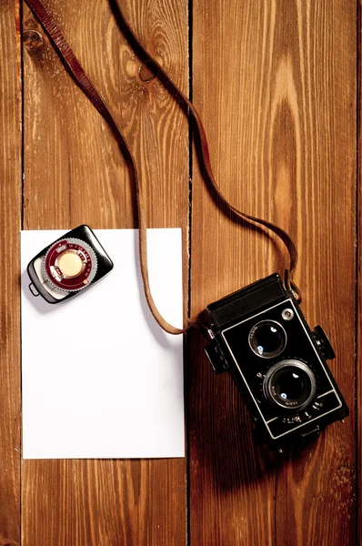 Vintage camera on wooden background — Stock Photo, Image