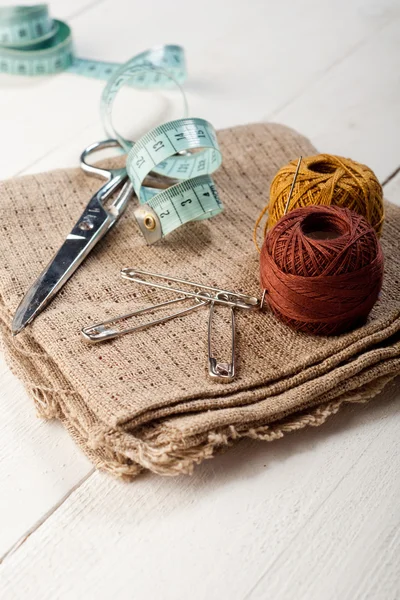 Sewing background with color threads, meter and scissors — Stock Photo, Image