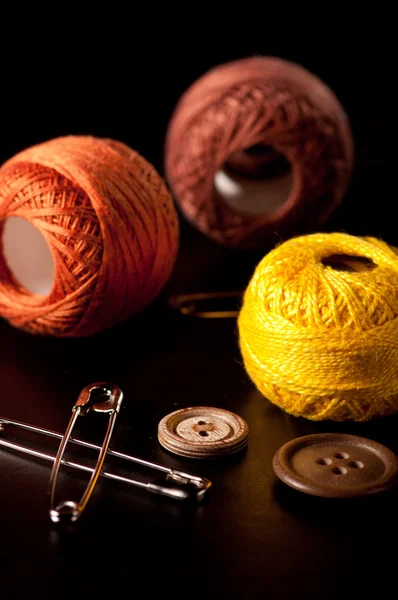 Spools of thread on a black background — Stock Photo, Image