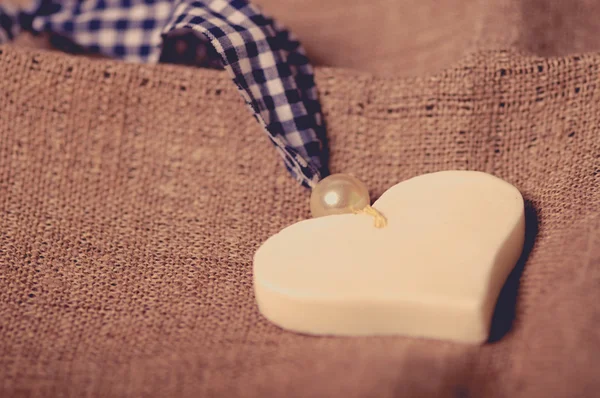 Heart lying on the fabric, the concept of Valentine's Day. Retou — Stock Photo, Image