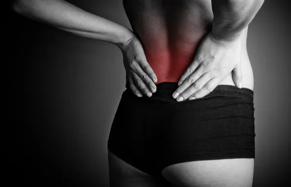 Woman suffering from back pain — Stock Photo, Image