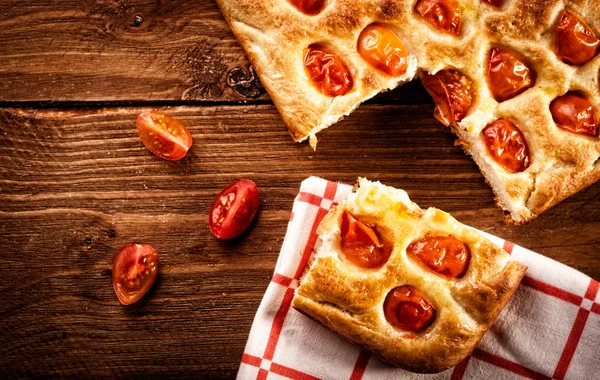 Focaccia with tomato and green olives. Retouching in retro style — Stock Photo, Image