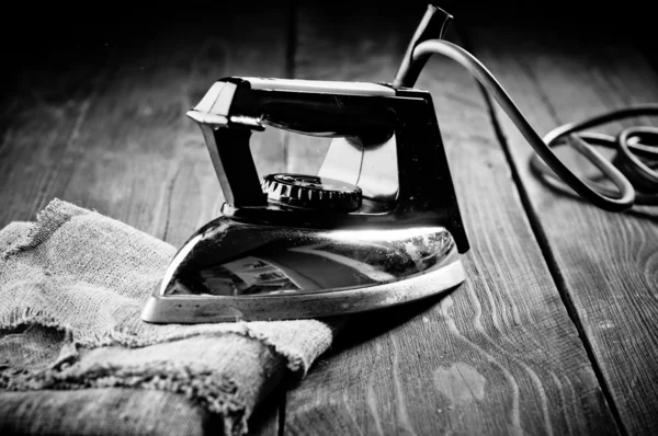 Old electric iron, touch-up in retro style. Black and White Phot — Stock Photo, Image