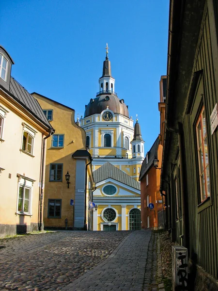 Street in Södermalm and church in the background