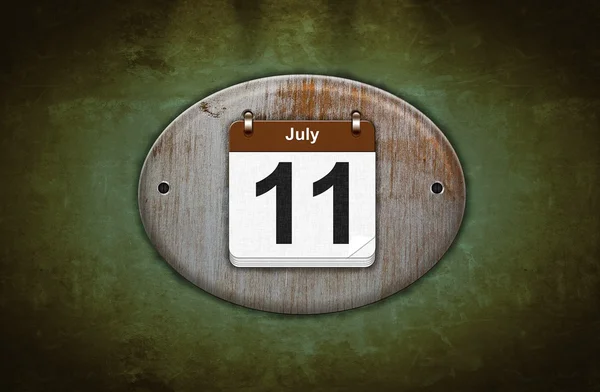 Vecchio calendario in legno con 11 luglio . — Foto Stock