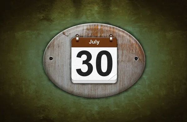 Old wooden calendar with July 30. — Stock Photo, Image