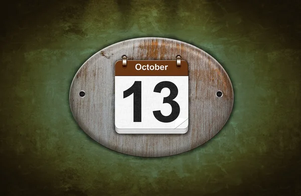 Alter hölzerner Kalender mit 13. Oktober. — Stockfoto