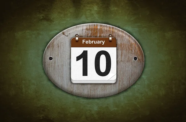 Oude houten kalender met 10 februari. — Stockfoto