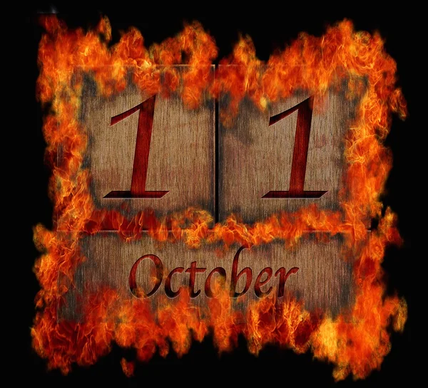 Burning wooden calendar October 11. — Stock Photo, Image