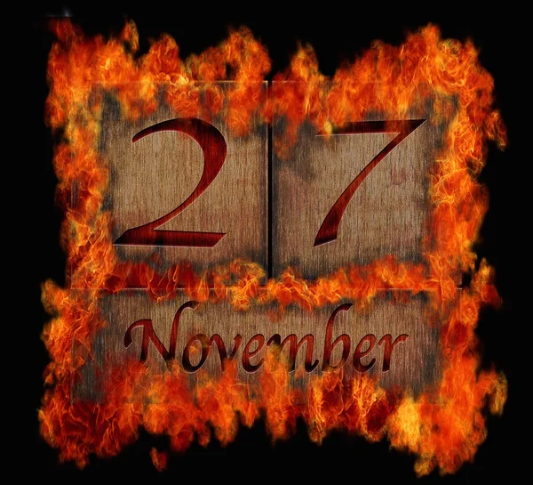 Hořící dřevěné kalendáře 27. listopadu. — Stock fotografie