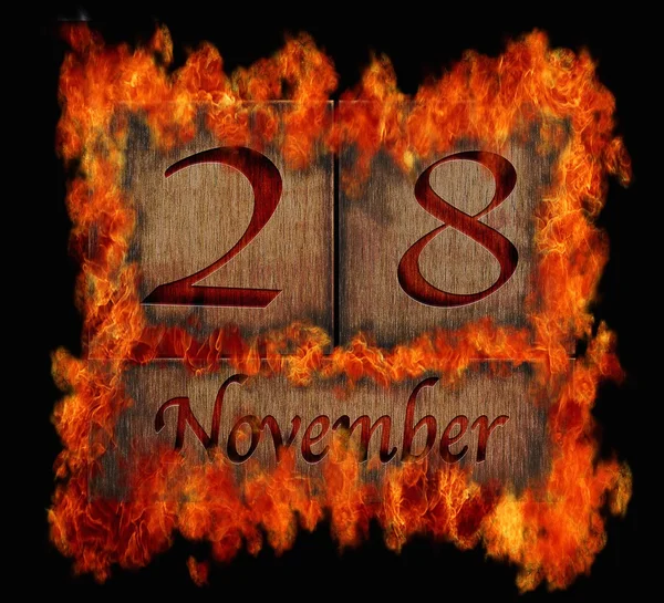Burning wooden calendar November 28. — Stock Photo, Image