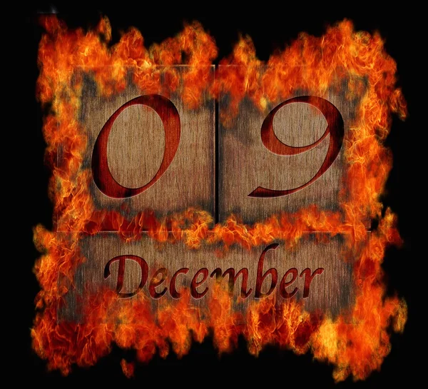Burning wooden calendar December 9. — Stock Photo, Image