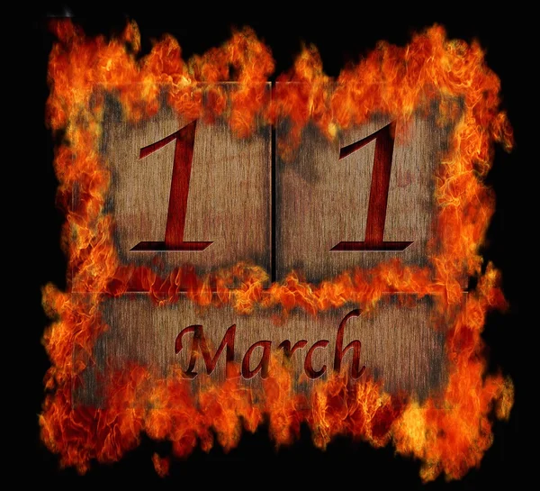 Brennende hölzerne Kalender 11. März. — Stockfoto