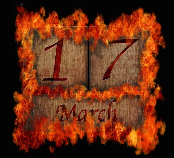 Brennende hölzerne Kalender 17. März. — Stockfoto