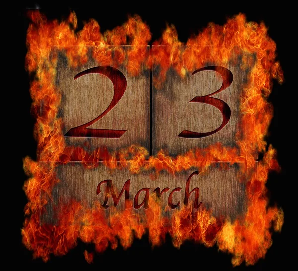 Burning wooden calendar March 23. — Stock Photo, Image