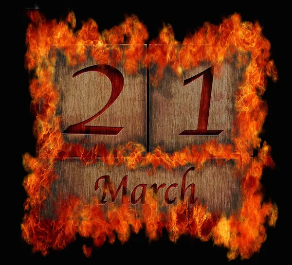 Burning wooden calendar March 21. — Stock Photo, Image