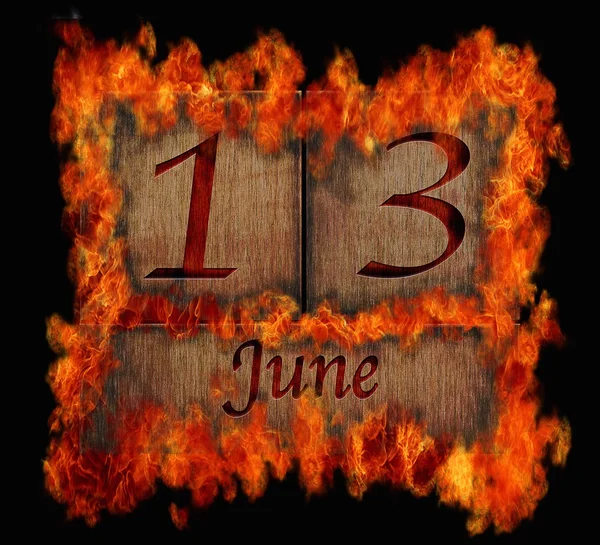 Burning wooden calendar June 13. — Stock Photo, Image