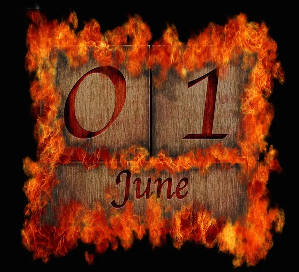 Burning wooden calendar June 1. — Stock Photo, Image