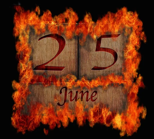 Burning wooden calendar June 25. — Stock Photo, Image