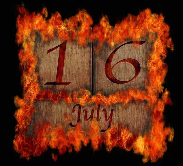 Burning wooden calendar July 16. — Stock Photo, Image