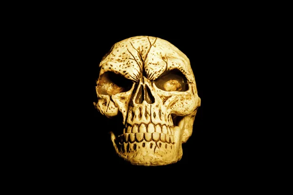 黒に分離されたオレンジ色の頭蓋骨 — ストック写真
