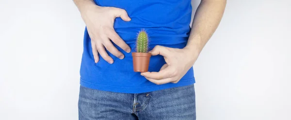 Conceito Homem Segura Cacto Perto Sua Mosca Problemas Sistema Geniturinário — Fotografia de Stock