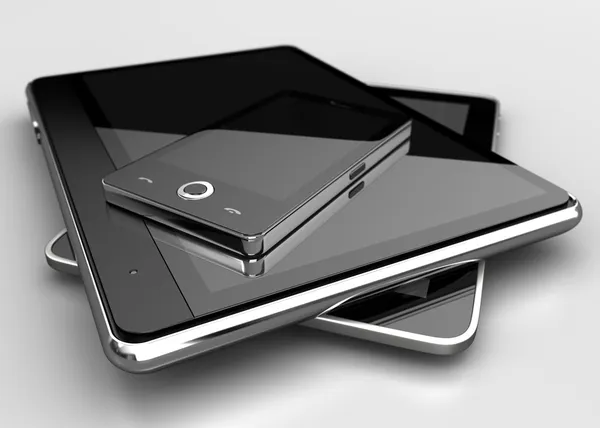 Téléphone portable avec tablettes numériques Photo De Stock