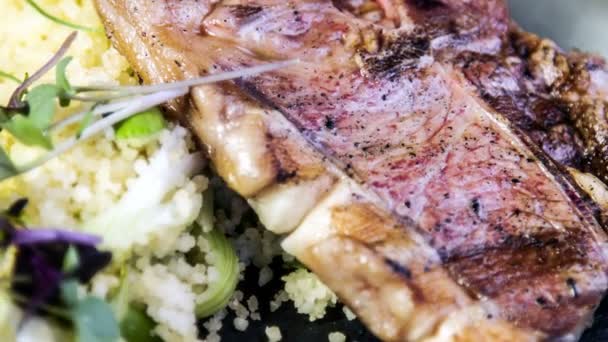 Lamb fillet and chop on asparagus cream with roasted couscous — Stock Video