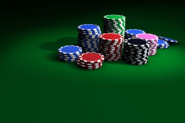 Yeşil masada poker fişleri