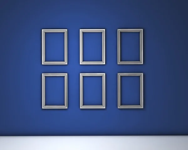 Lege frames op blauwe muur — Stockfoto