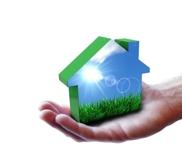 Hand med grön eco house natur — Stockfoto