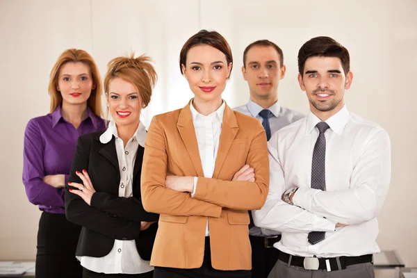 Business people smiling with arms crossed — Stock Photo, Image
